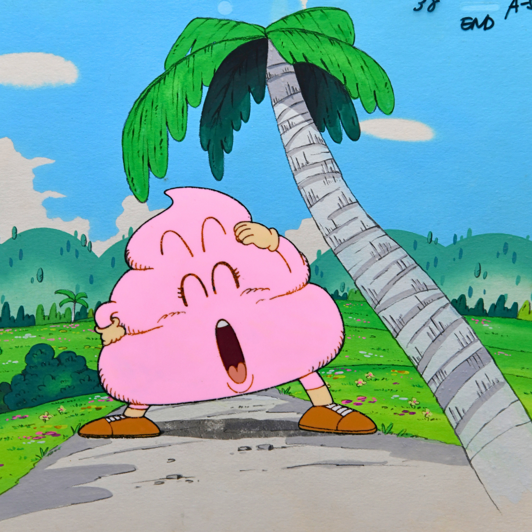 Pink Poop character cel from Dr. Slump posed beside a palm tree on the original painted background