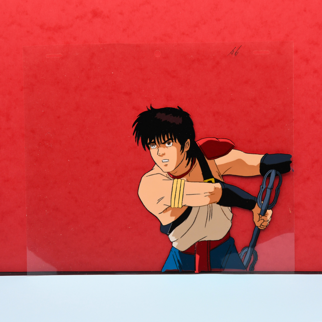 Shurato Hidaka holding the Vajra original production cel from Shurato